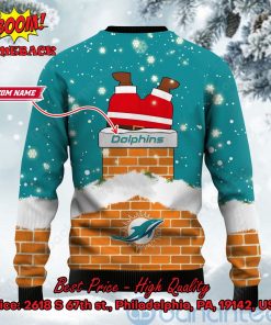 miami dolphins santa claus on chimney personalized name ugly christmas sweater 3 U5cV9